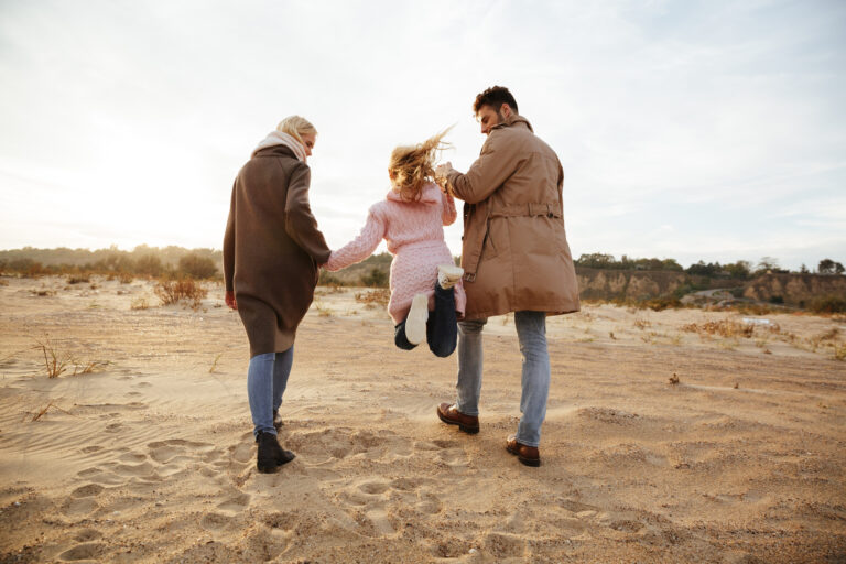 Portrait of a beautiful family with a little daughter